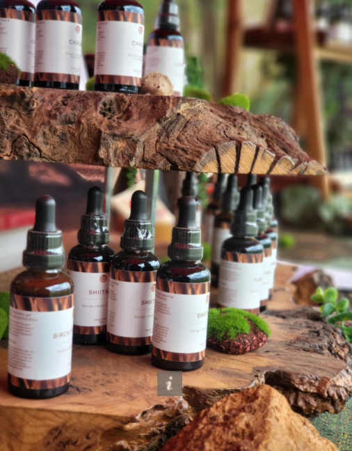 Bottles with droppers on a wooden surface with a natural background
